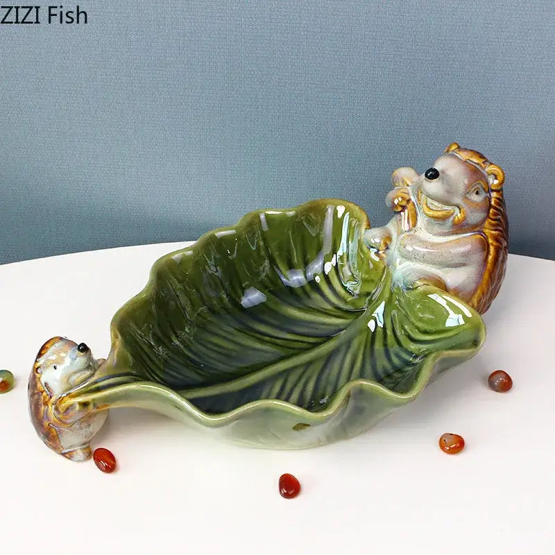 Glossy green decorbites ceramic leaf decor tray with two whimsical porcupine figurines for dining room storage