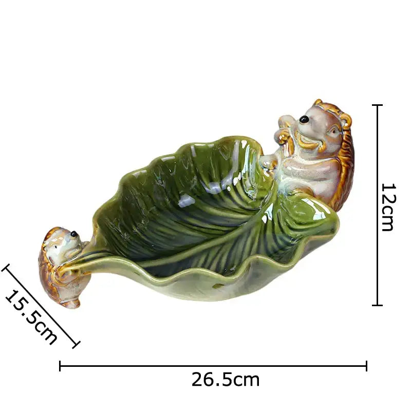 Green ceramic leaf decor tray featuring two whimsical porcupine figurines for dining room storage by decorbites ceramic leaf