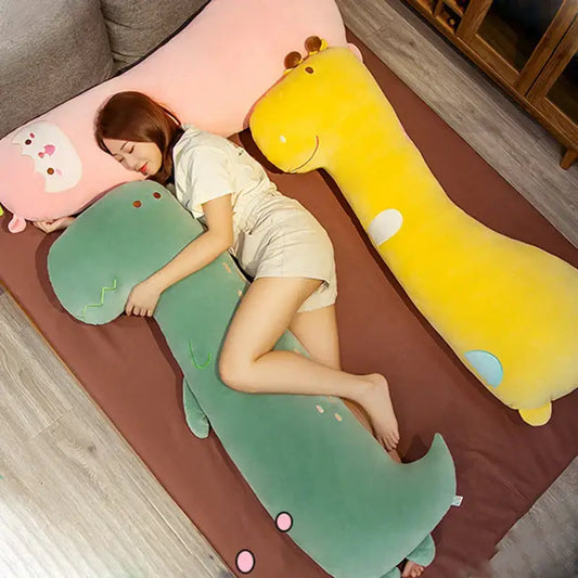 Green dinosaur cartoon comfort body pillow with embroidered facial features and pink circular accents plush gift