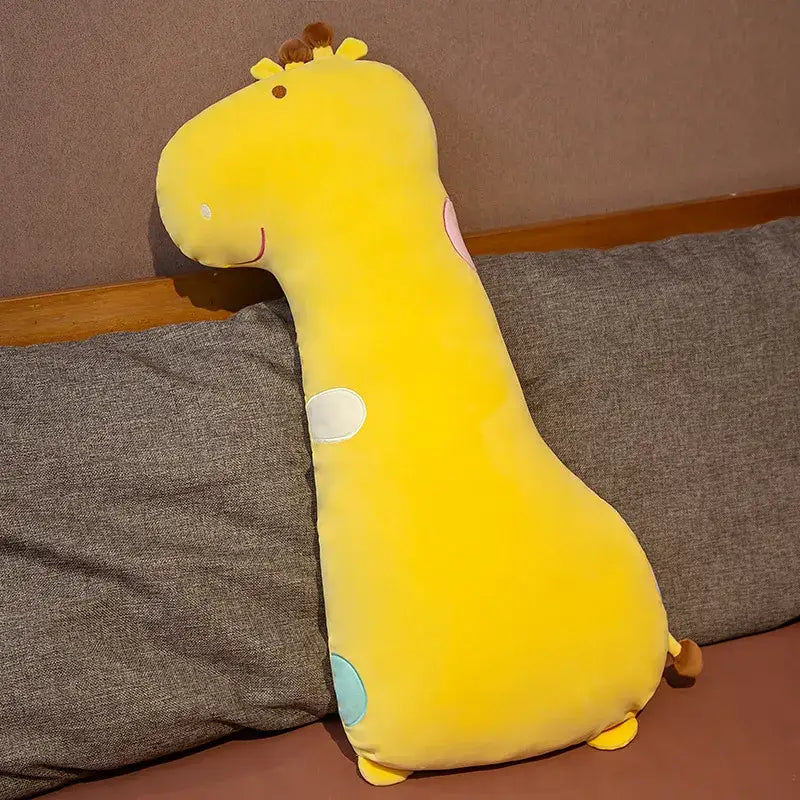 A plush yellow giraffe cartoon comfort body pillow with soft velvety texture and colorful circular patches
