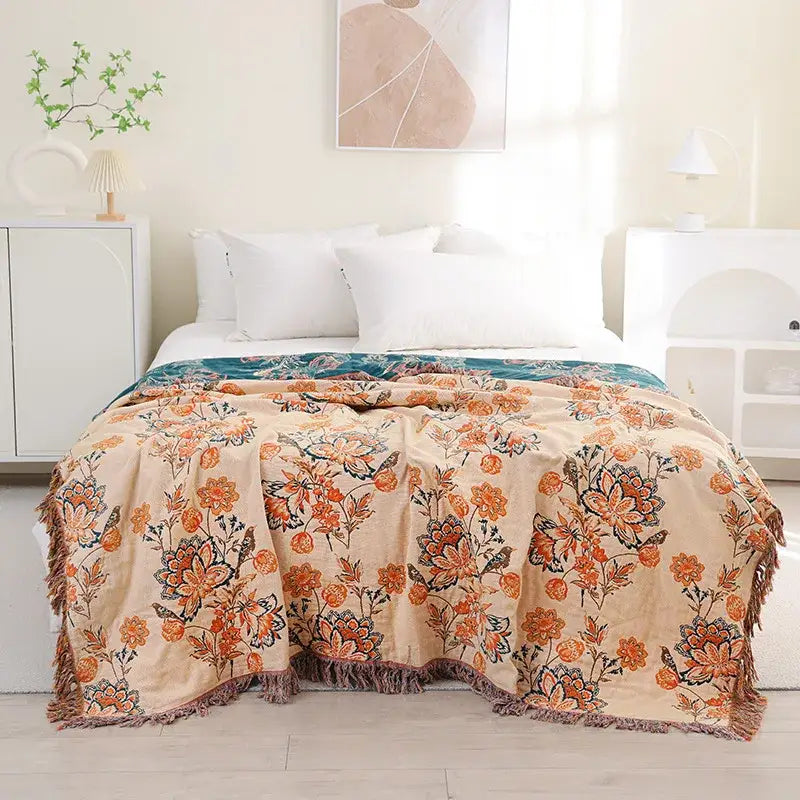 Beige decorbites cotton tassel sofa blanket with orange teal floral design and textured fringe for living room decor
