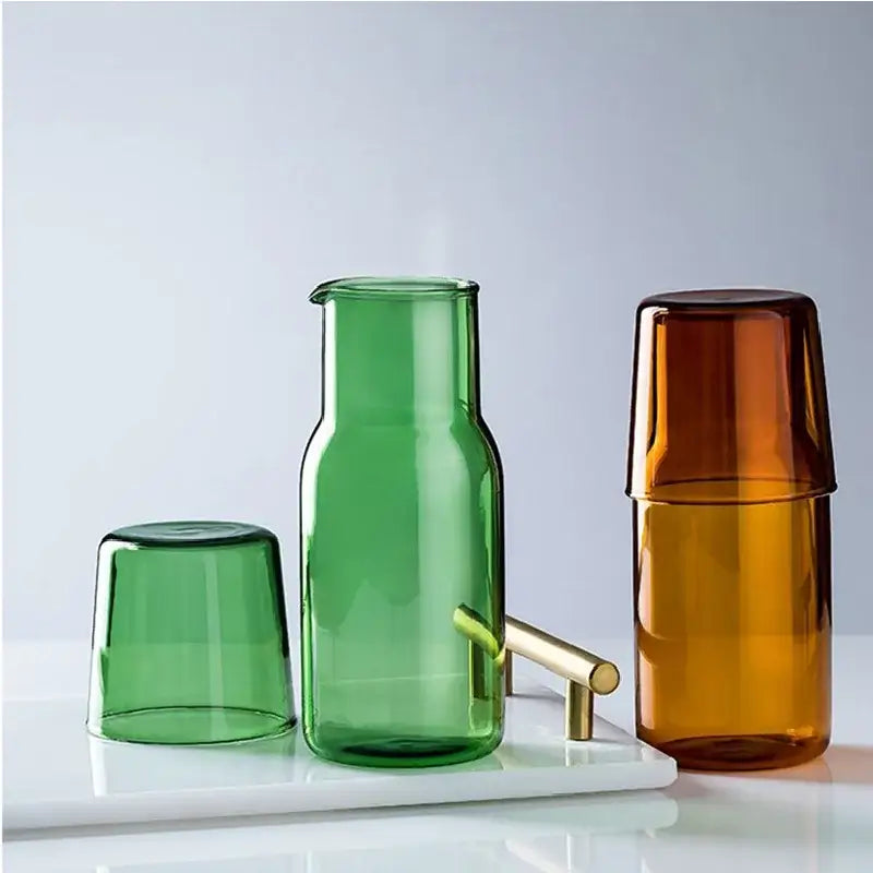 Green glass 550ml bedside water carafe with gold-tone handle and spout for bedroom use