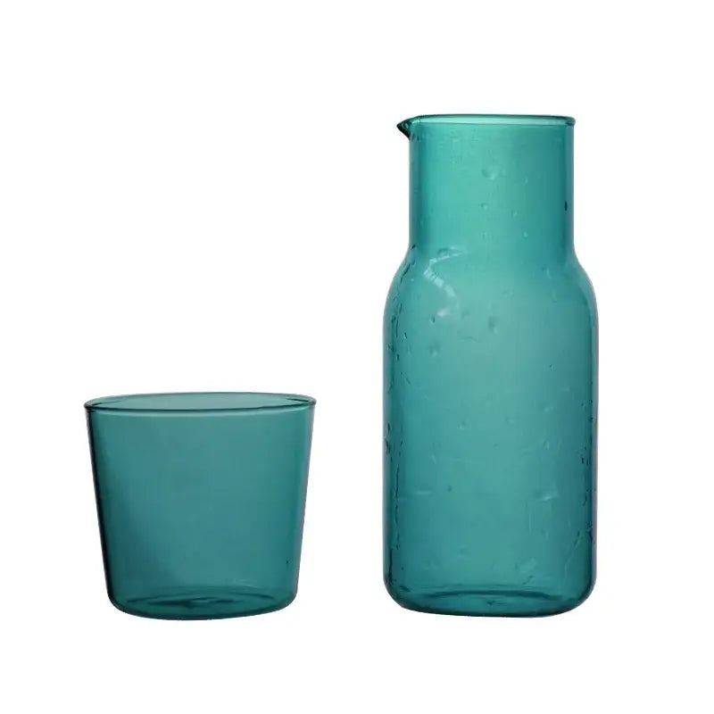 Teal glass 550ml bedside water carafe with spout and matching tumbler for bedroom use in bedside water carafe set