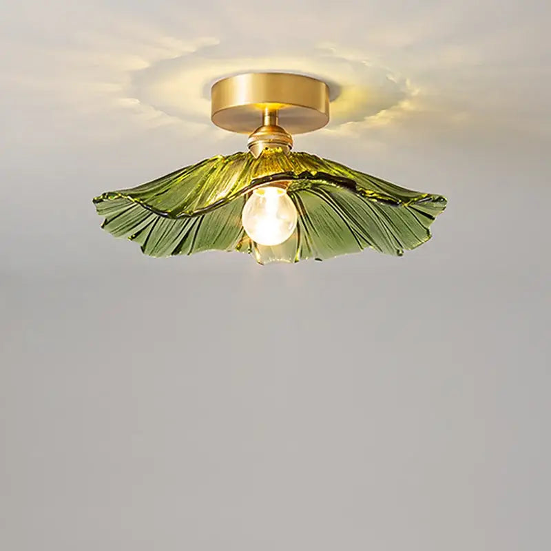 Green glass leaf copper nordic ceiling lamp with brass-finished base and exposed bulb for living room lighting