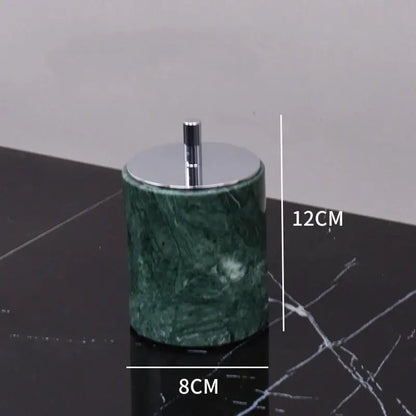 Green marble bathroom cylindrical ashtray with polished chrome lid and stem from marble bathroom set with gold accents