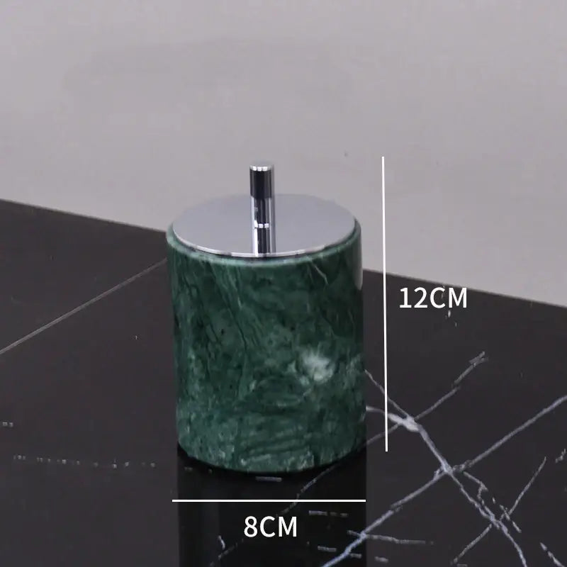 Green marble bathroom cylindrical ashtray with polished chrome lid and stem from marble bathroom set with gold accents