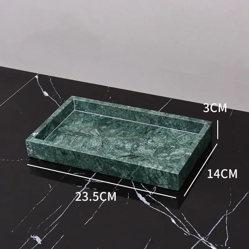 A rectangular green marble bathroom tray with polished veined surface and raised edges from a marble bathroom set