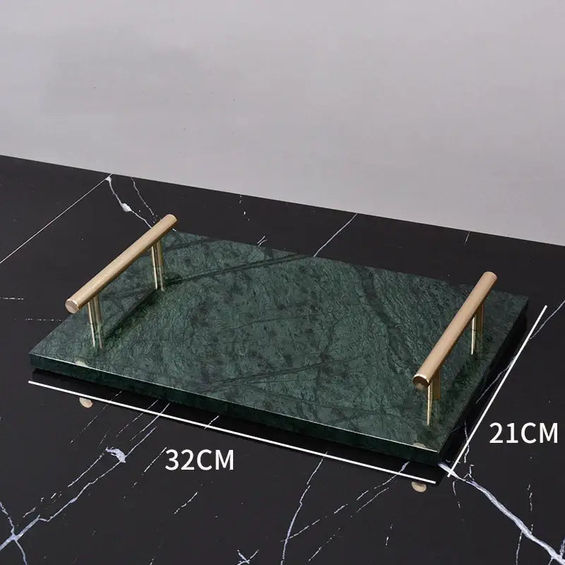 A sleek rectangular serving tray with a deep green marble surface and polished brass handles for green marble bathroom use