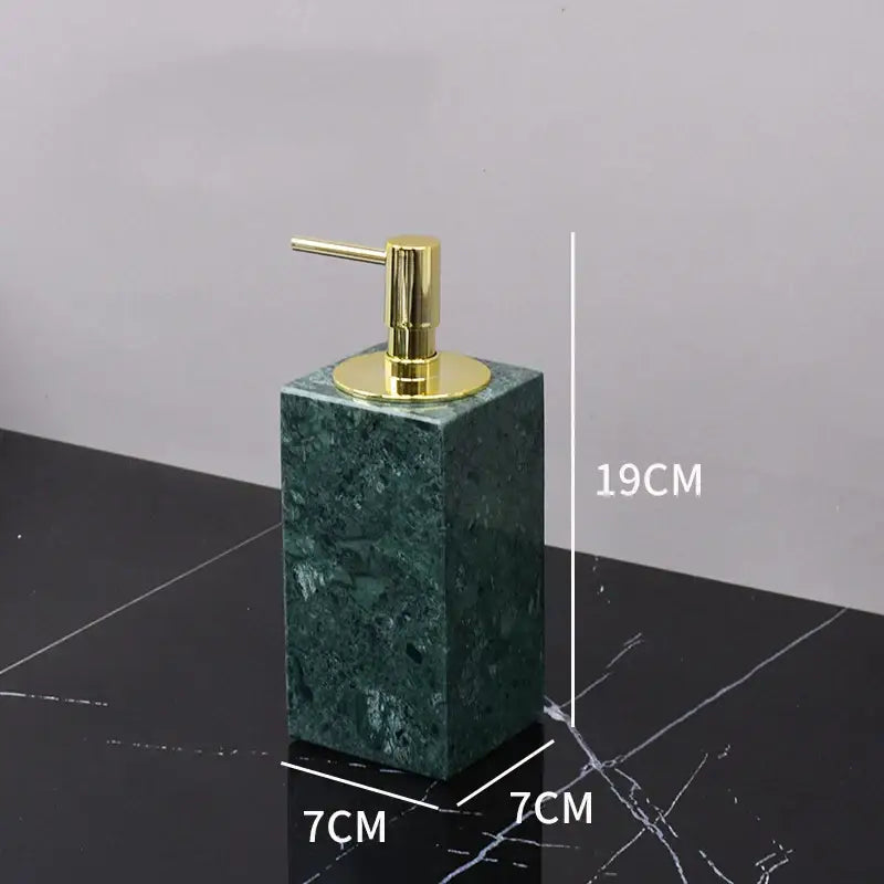 A sleek rectangular green marble soap dispenser with a polished gold-tone pump from a green marble bathroom set