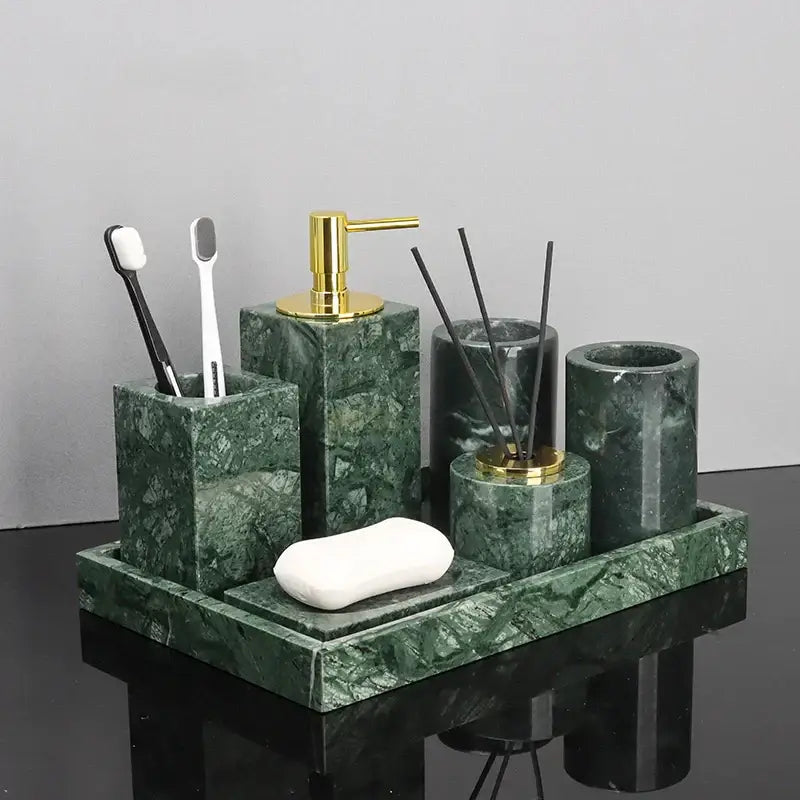 Green marble bathroom set with gold-tone accents featuring marble accessories for elegant bathroom decor