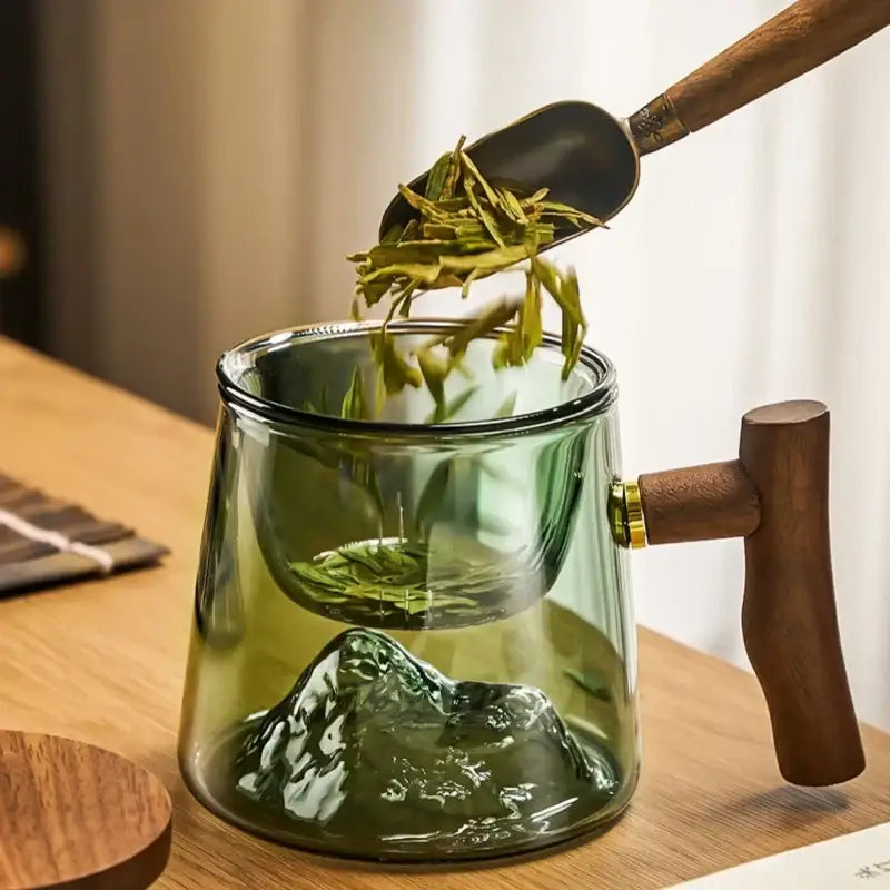 Translucent green glass tea cup set with wooden handle and mountain design by decorbites glass tea for dining room use