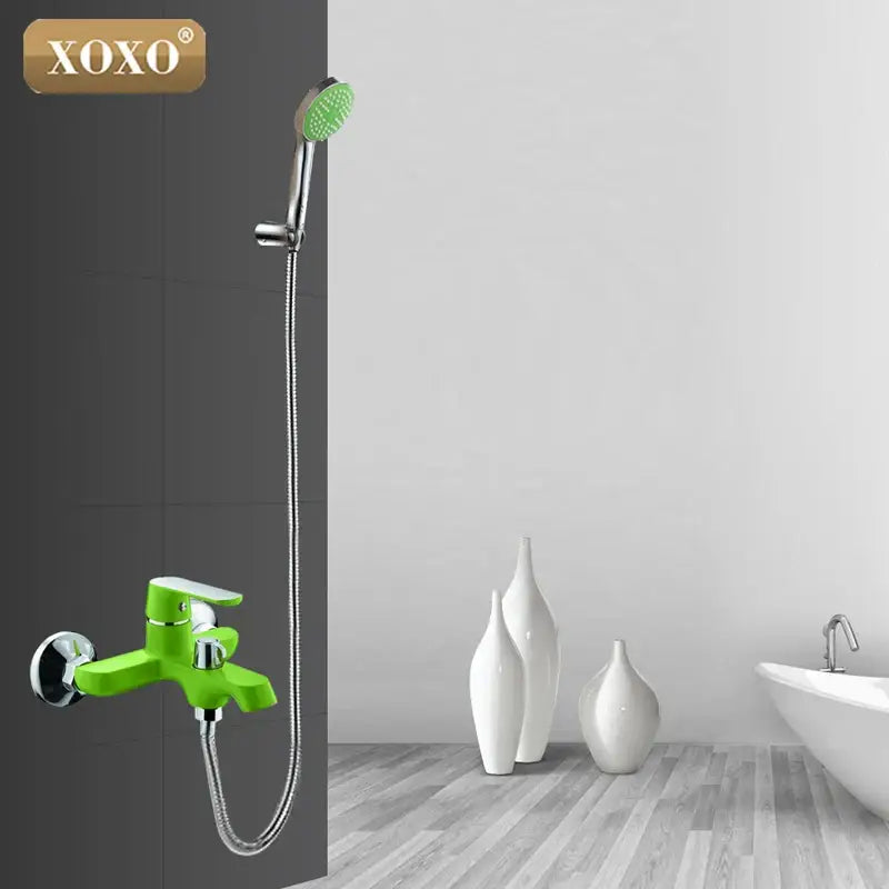 Green and orange chrome shower faucet set with bright green XOXO brand faucet and matching handheld showerhead hose