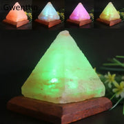 Green pyramid himalayan crystal usb salt night light with glowing rough texture on dark wooden base for bedroom decor