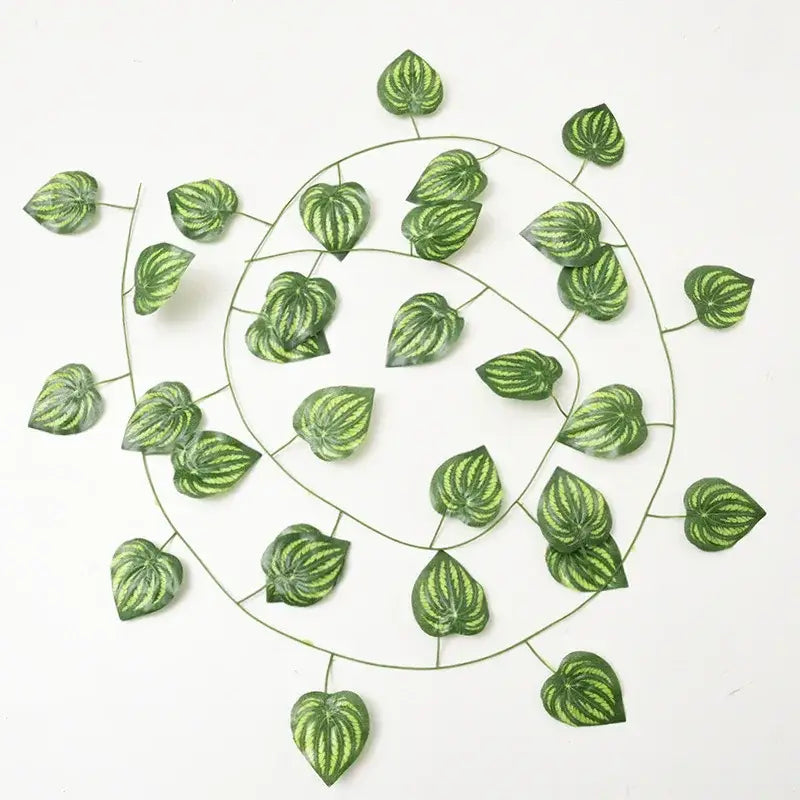 Green silk artificial ivy hanging garland with striped watermelon vine leaves arranged on a wire frame decorbites green silk