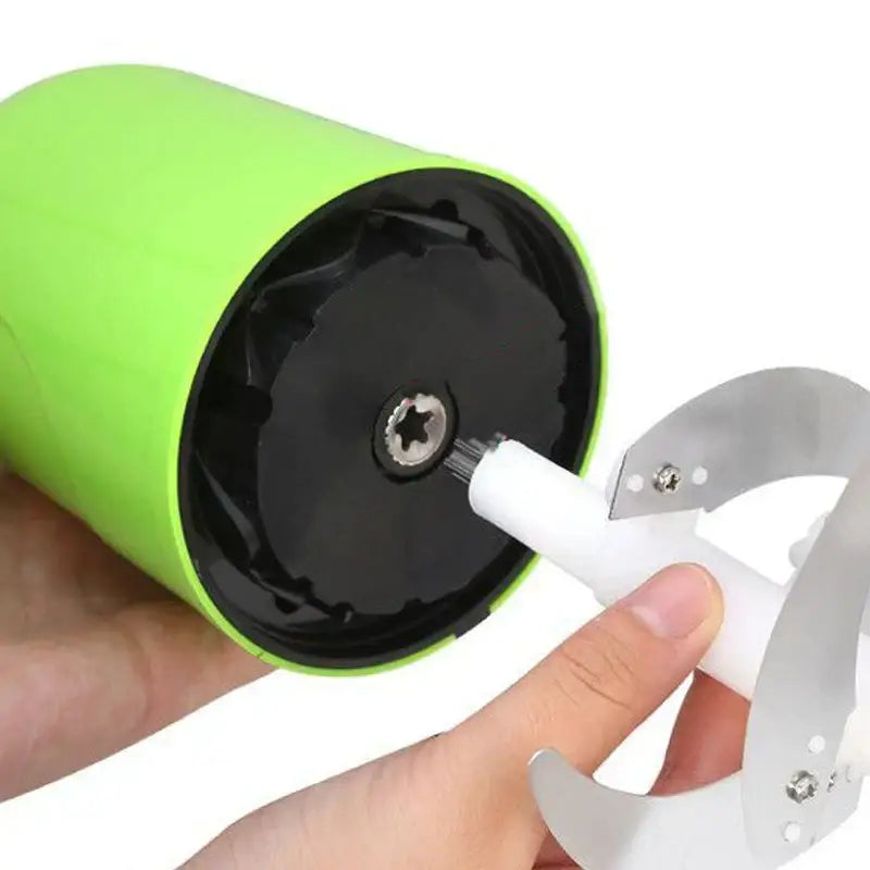 Bright green stainless steel electric meat grinder with black interior and white plastic parts for kitchen processing