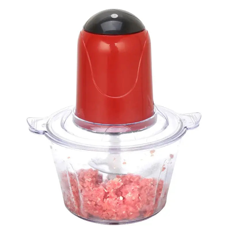 Red plastic food processor with black top and clear bowl containing ground meat in stainless steel electric meat grinder set