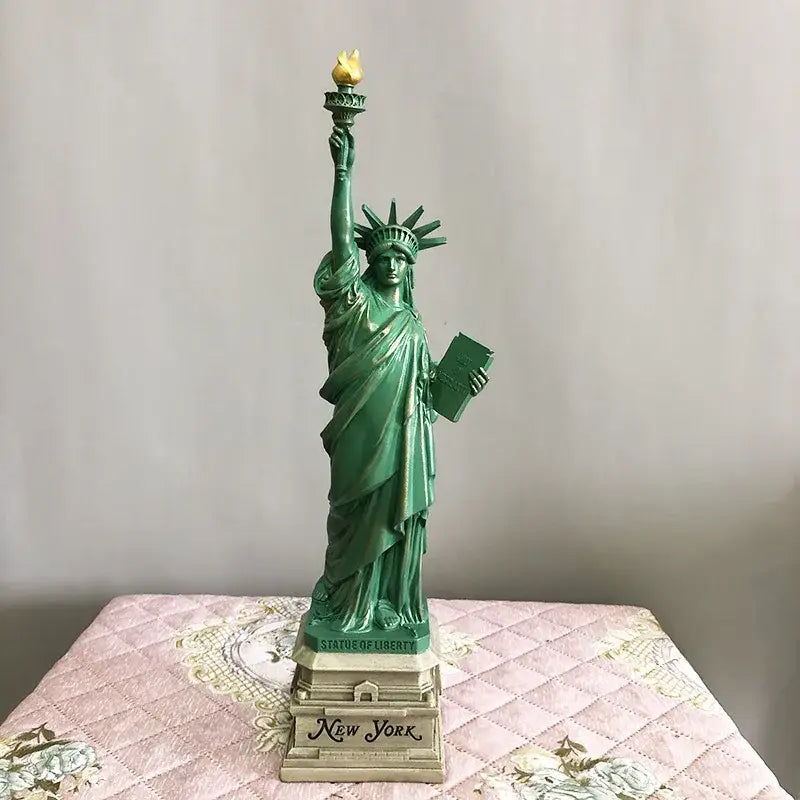 Green resin decorbites liberty statue desk model with gold-tipped torch and beige base inscribed new york