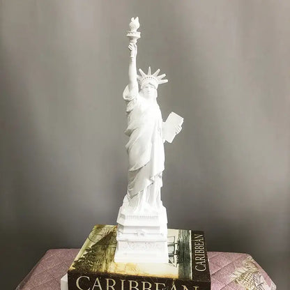 White resin decorbites liberty statue desk model with raised torch and tablet on book base for office decor