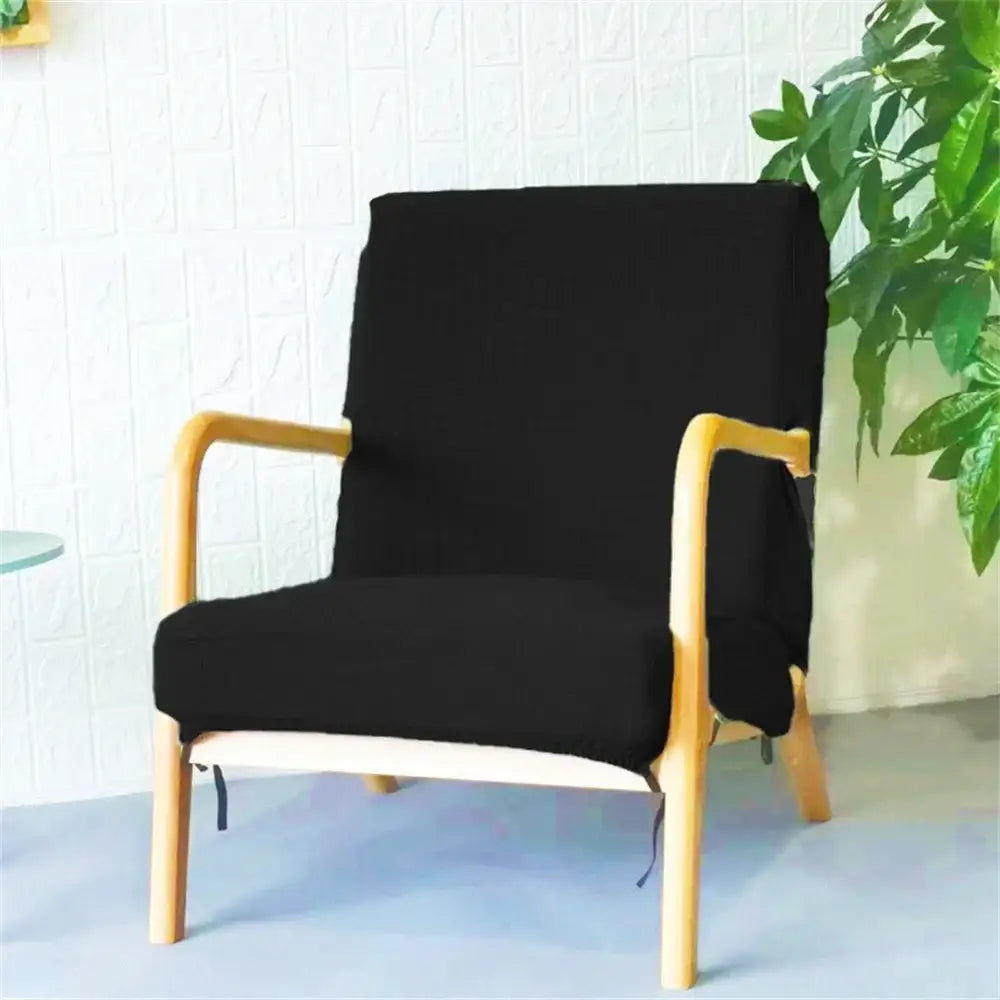 Black fabric decorbites jacquard elastic seat cover snugly fitted on a light wood-framed dining chair