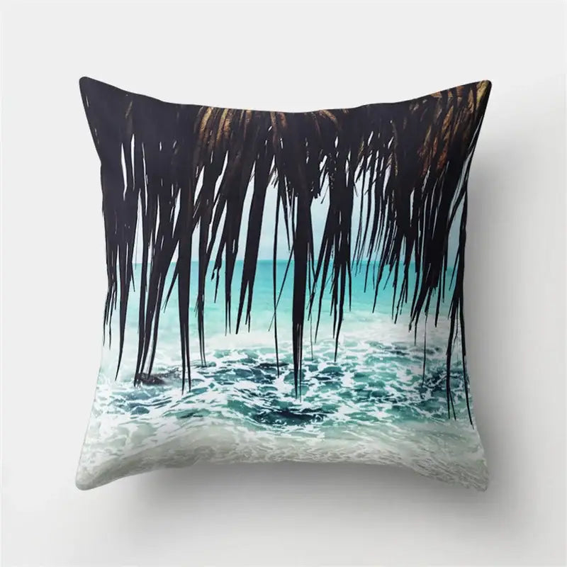 Square throw pillow with decorbites green tropical leaves featuring dark palm fronds and turquoise ocean waves decor