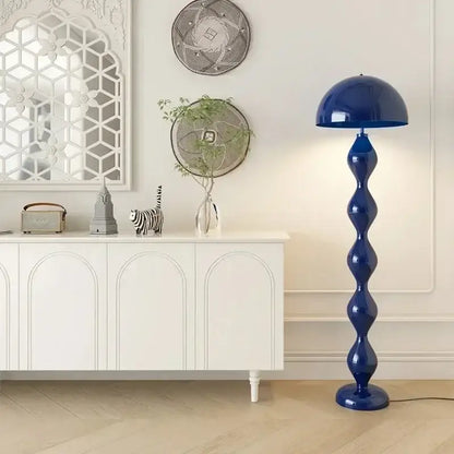 A striking cobalt blue floor lamp with a glossy sculptural base and domed shade for decorbites circle mushroom floor lighting