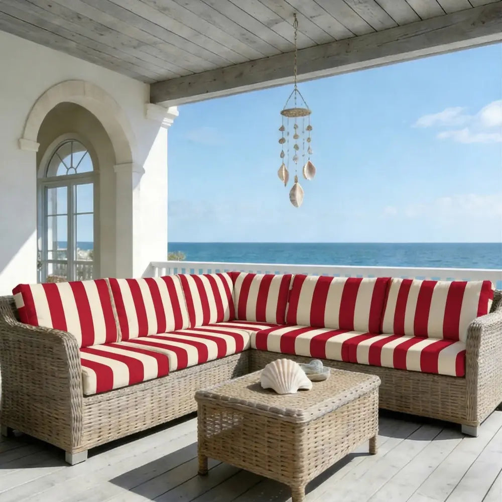 Red and cream striped outdoor sectional sofa with woven wicker frame featuring green and white striped cushion covers