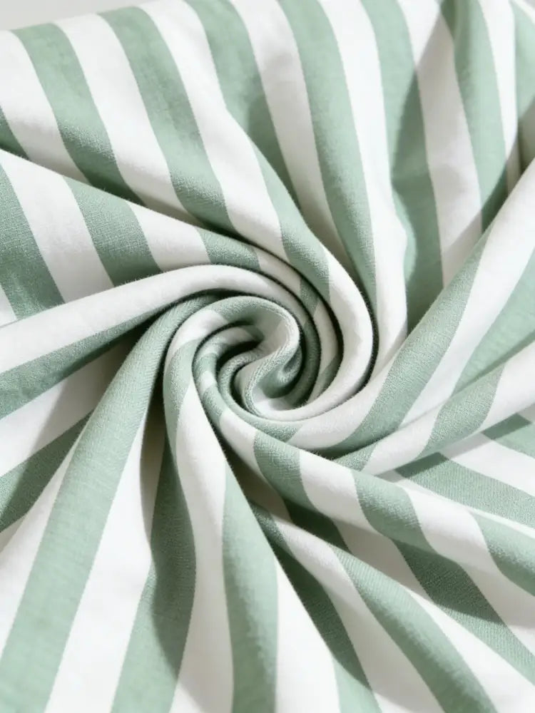 Green and white striped sofa cushion cover with soft mint green fabric and gentle drape for living room protection