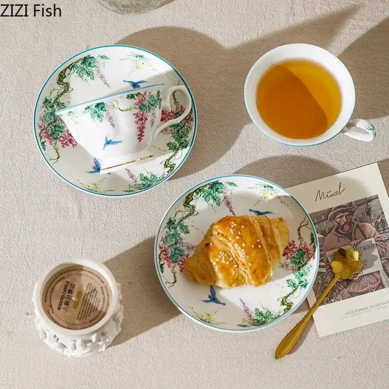 White porcelain green willow porcelain tea cup and saucer set with pink green and blue floral and bird motifs for dining tableware
