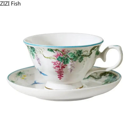 Green willow porcelain tea cup with hand-painted pink wisteria floral design, light blue rim, and gold trim for decorbites green willow