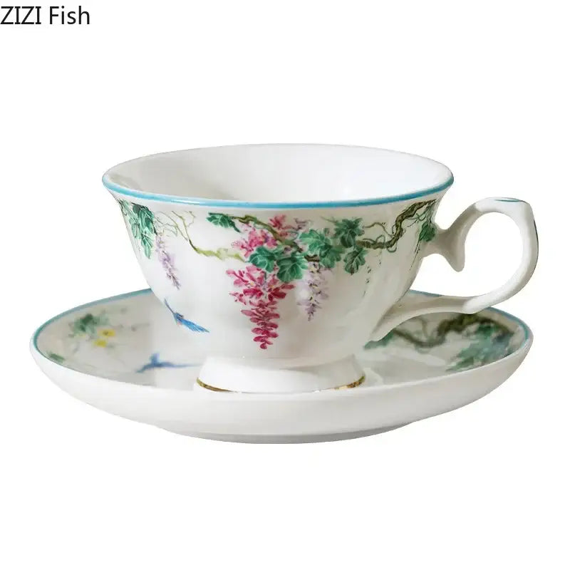 Green willow porcelain tea cup with hand-painted pink wisteria floral design, light blue rim, and gold trim for decorbites green willow