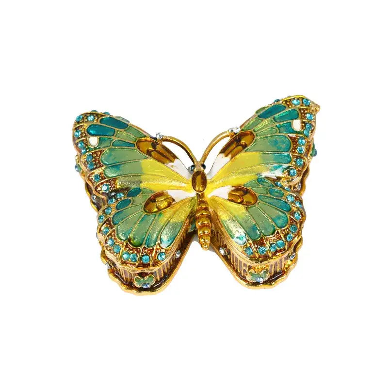 Decorbites butterfly enamel jewelry box with iridescent green and yellow wings outlined in gold and blue rhinestones