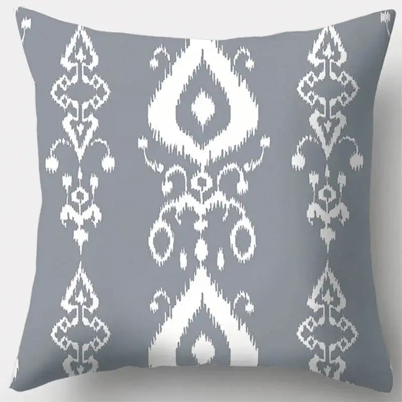 Gray throw pillow case with white ikat pattern featuring grey geometry leaves for living room decor