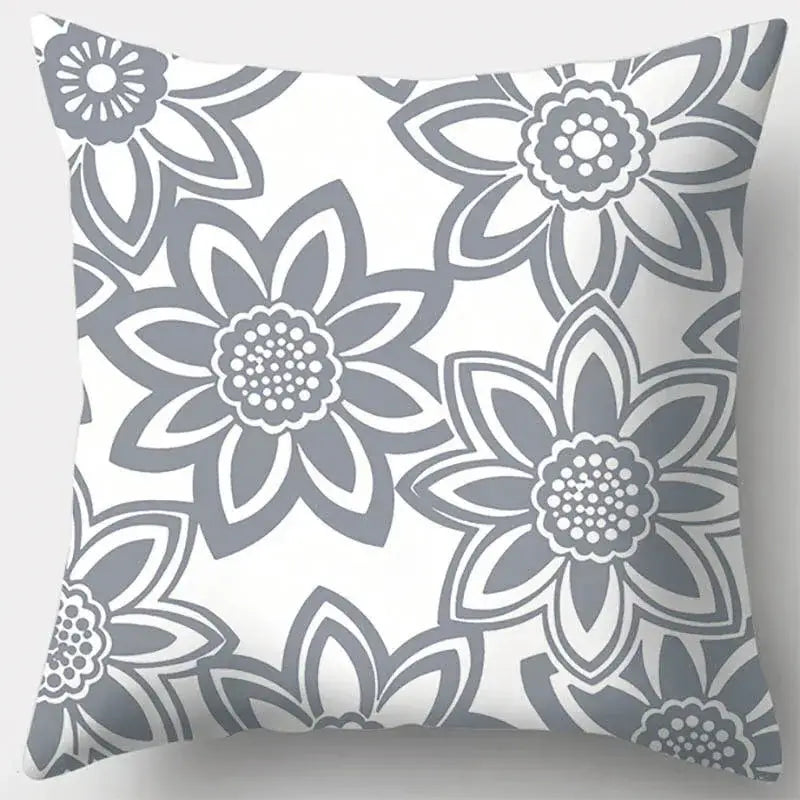 A square pillow case with grey geometry stylized flowers on white background for living room decor