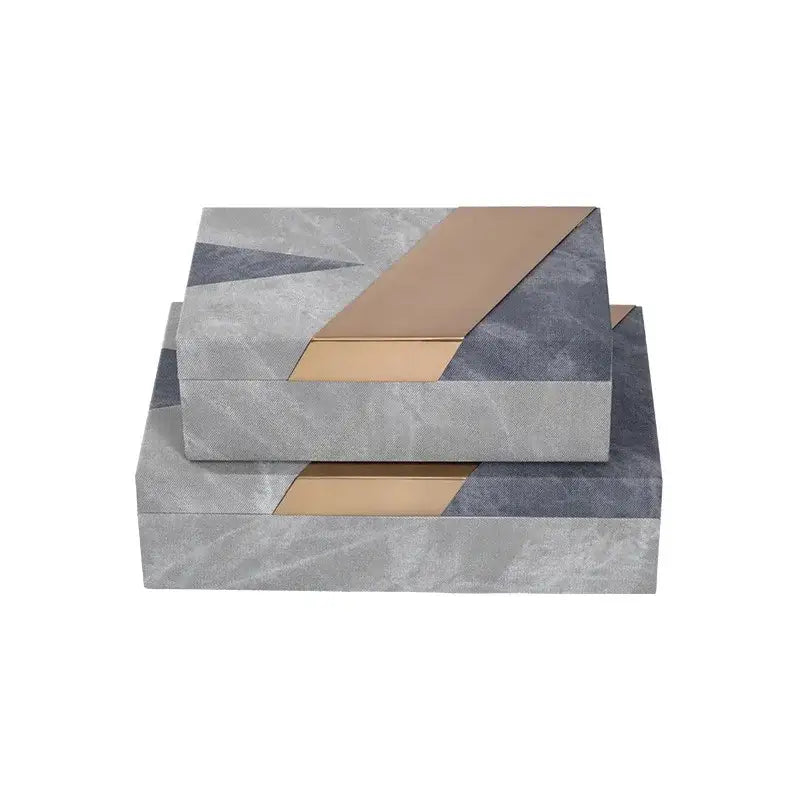 Stacked rectangular jewelry container with grey marble pattern leather and gold metallic panels for desktop organization