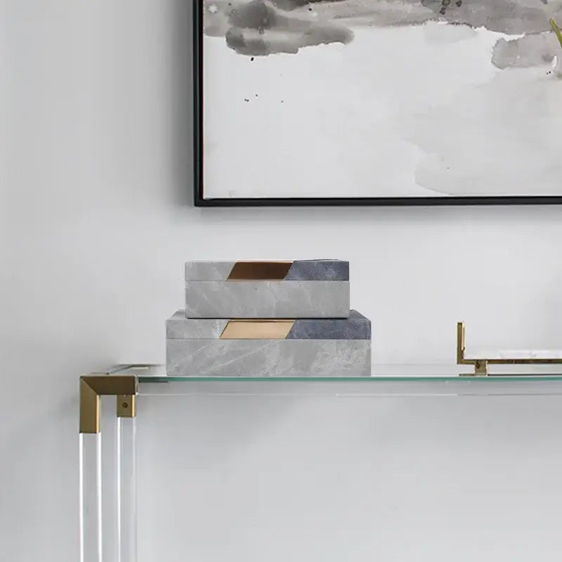 Stacked rectangular grey marble pattern leather jewelry container with gold-toned lids for bedroom desktop organization