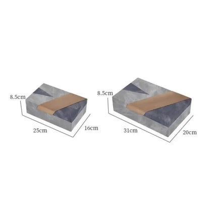 Two rectangular concrete jewelry containers with grey marble pattern and tan leather accents for desktop organization