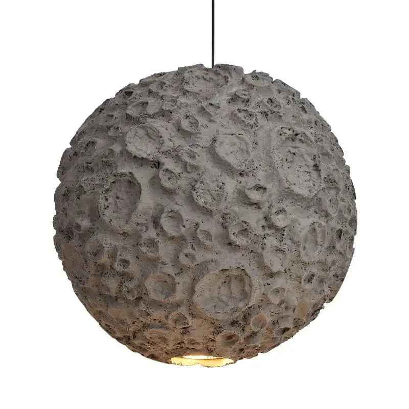 Gray concrete pendant light with textured cratered surface resembling the moon grey wabi sabi chandelier for living room