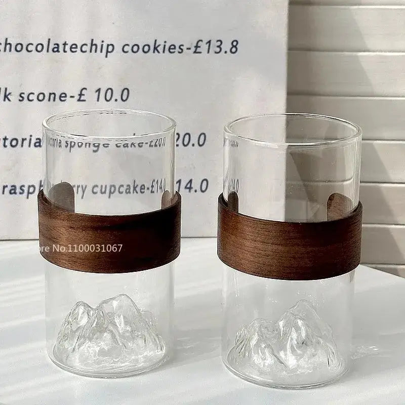 Clear glass guanshan hanging ear coffee cup with mountain-shaped base and dark wood band for kitchen drinkware decorbites