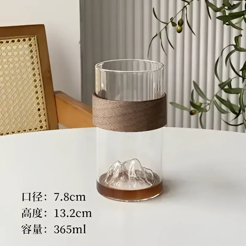 Clear glass guanshan hanging ear coffee cup with ribbed top, wood band, and etched mountain base by decorbites