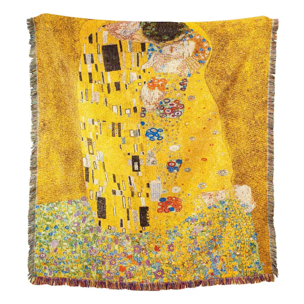 A vibrant yellow woven tapestry bedroom blanket featuring gustav klimt the kiss art pattern with multicolored fringe