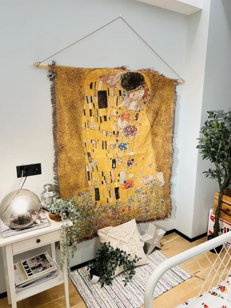 A textured mustard-yellow woven tapestry blanket featuring gustav klimt the kiss art pattern for bedroom decorbites decor