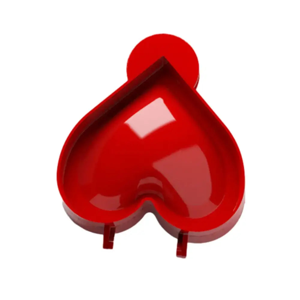 Glossy red heart-shaped silicone hand pie mold with circular handle and feet from halloween pie molds set kitchen tools
