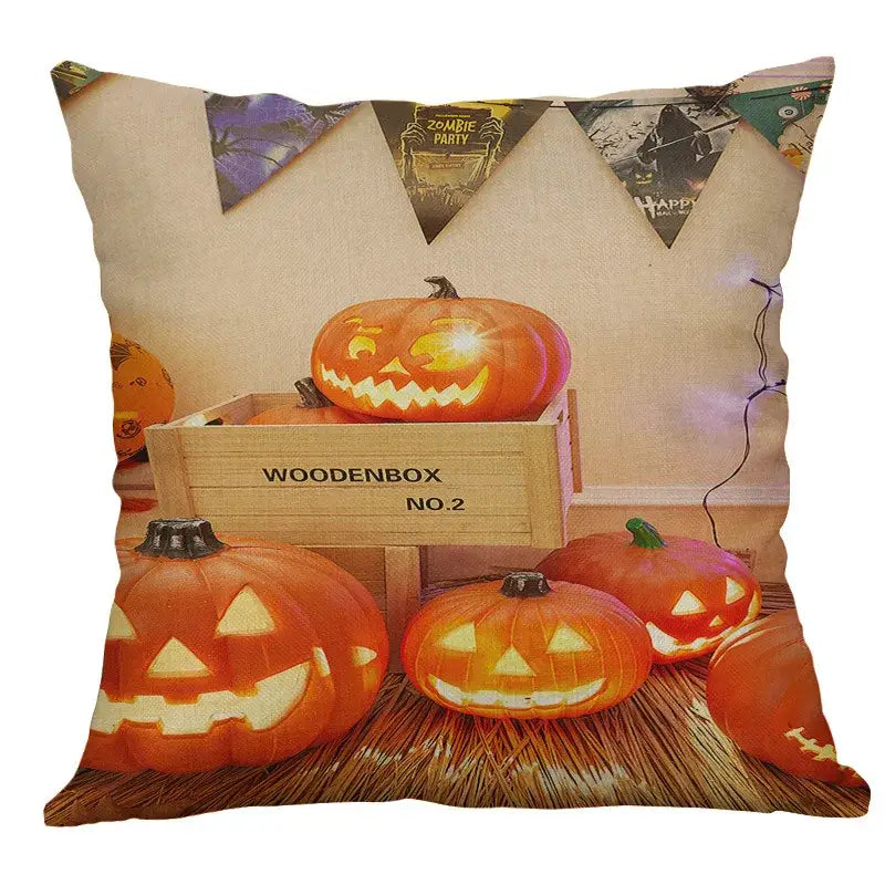 Halloween pumpkin ghost bat linen pillow cover featuring orange jack o lanterns and wooden crate on straw background