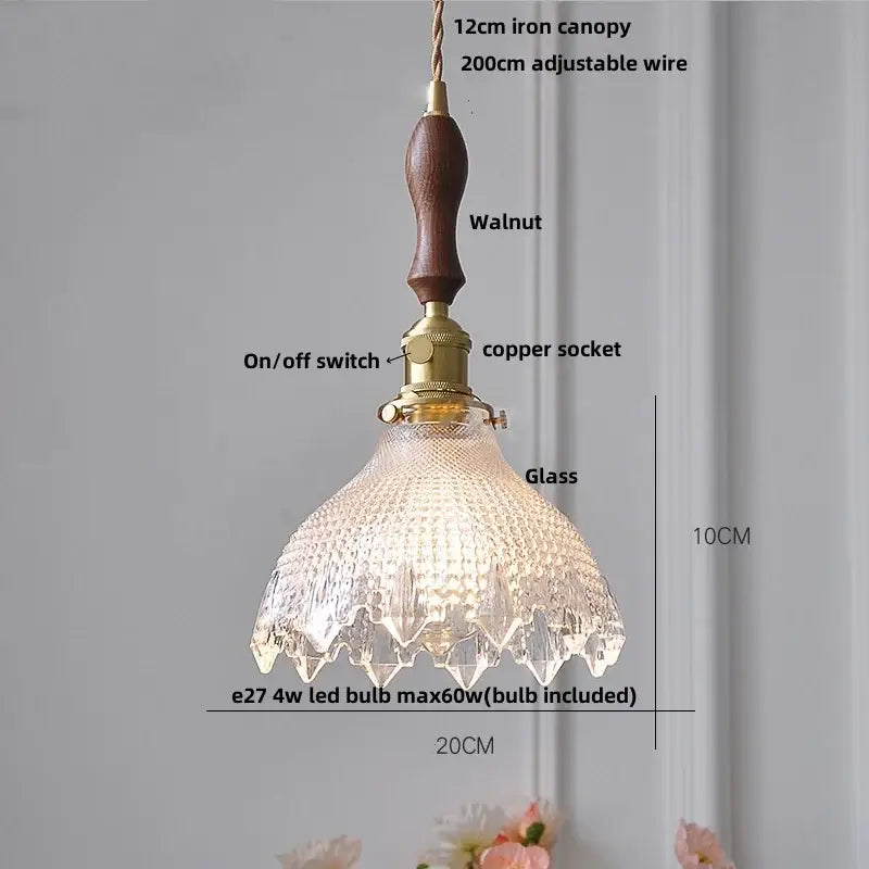 Hammered amber glass led pendant light with clear textured glass, walnut iron canopy, and brass hardware for kitchen use