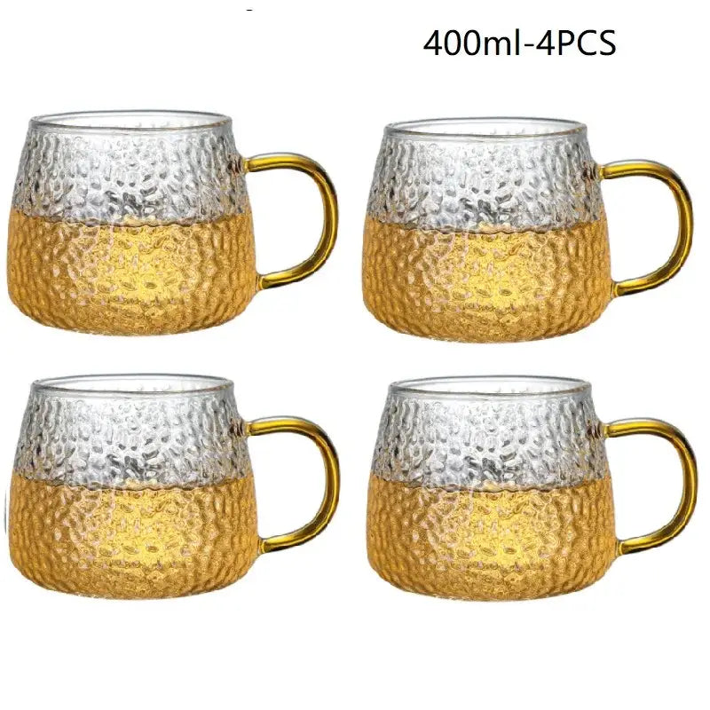 Set of four 400ml hammered clear glass water cups with gold lower halves and golden handles for kitchen use