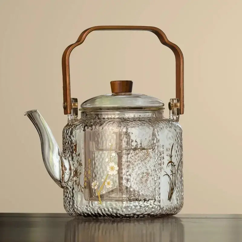 Clear glass teapot with hammered texture white floral green vine gold foil decals and bronze wooden handle decorbites glass teapot