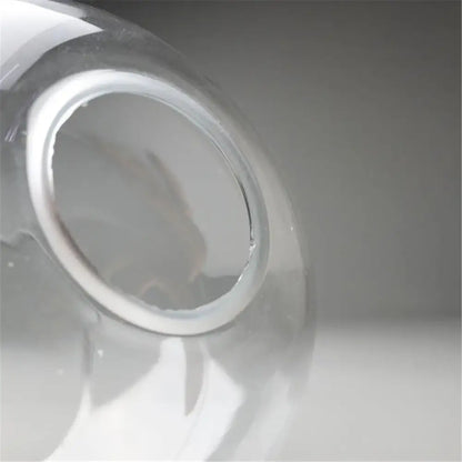 Hand blown clear glass globe lampshade with smooth rounded neck and white plastic seal for living room lighting