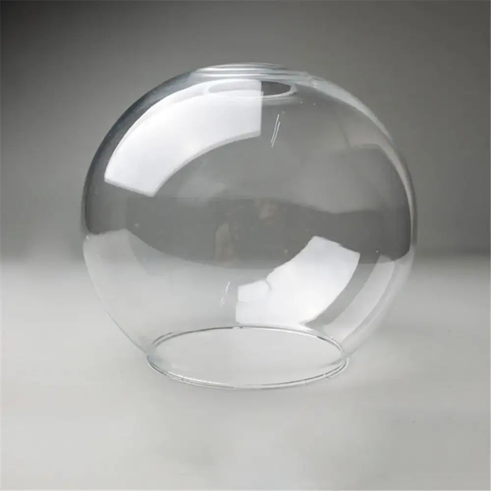 Hand blown clear glass globe lampshade with smooth rounded shape and flat base for living room lighting