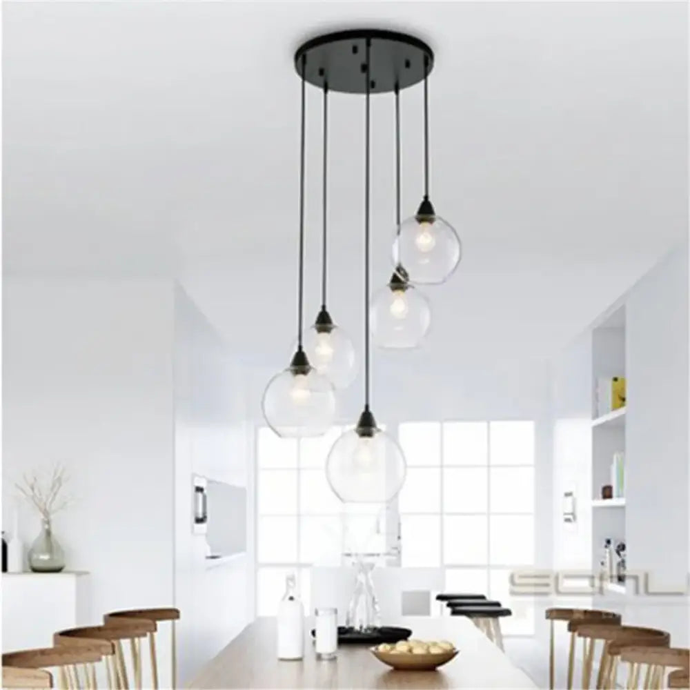 Modern black metal pendant light with hand blown clear glass globe lampshades for living room lighting