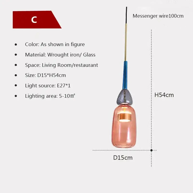 A sleek peach-tinted hand-blown decorbites candy glass pendant light with matte black iron top and blue accent wire